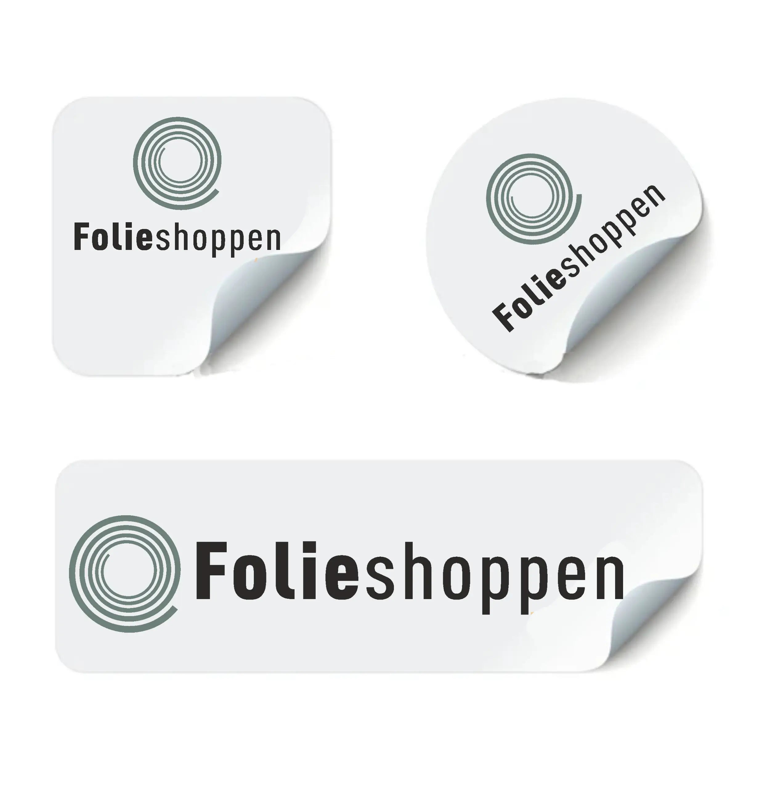 Tre klistermærker med "Folieshoppen" logo i firkant, cirkel og rektangel, alle med løftet hjørne.