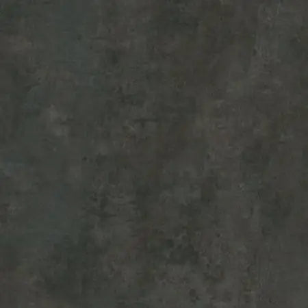 Nærbillede af mørk, mat overflade med varieret tone og slidt udseende.